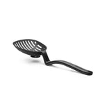Dreamfarm Lestrain strainer spoon with a black handle and a silicone brush tip