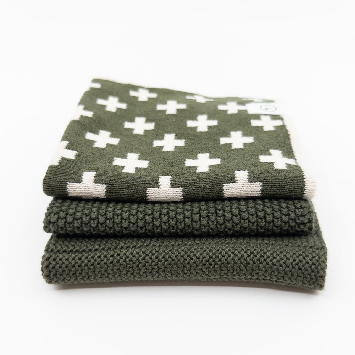 Ecovask dishcloth variety three pack in olive green, with a white cross print towel and knitted cloths