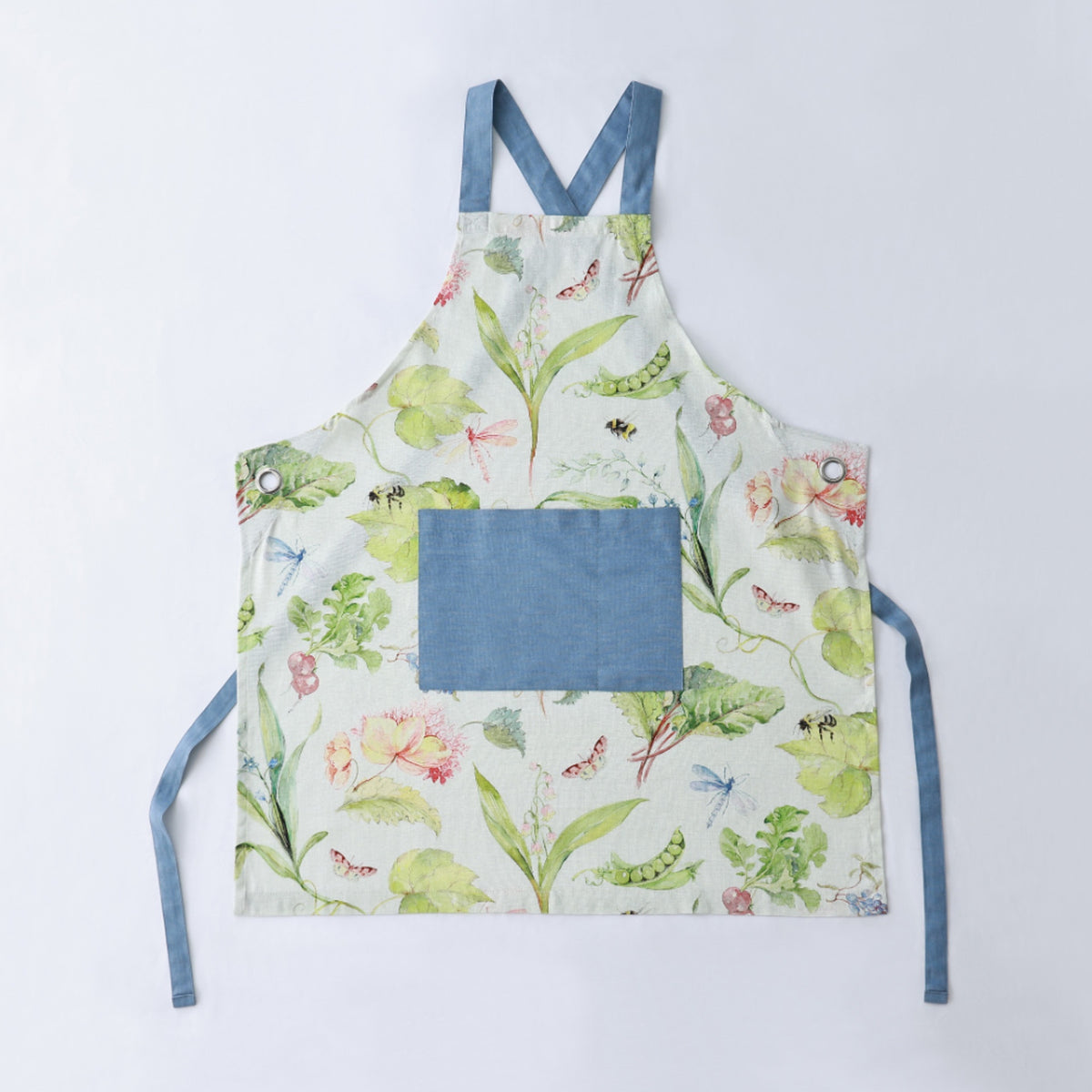 MM Linen Essie apron in white with a botanical pea and frog print, a blue pocket and blue straps