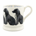 Emma Bridgewater half pint mug with a design of black and white cocker spaniels