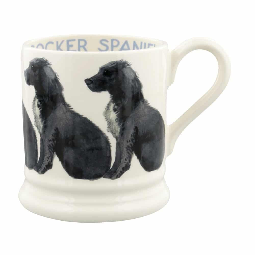 Emma Bridgewater half pint mug with a design of black and white cocker spaniels