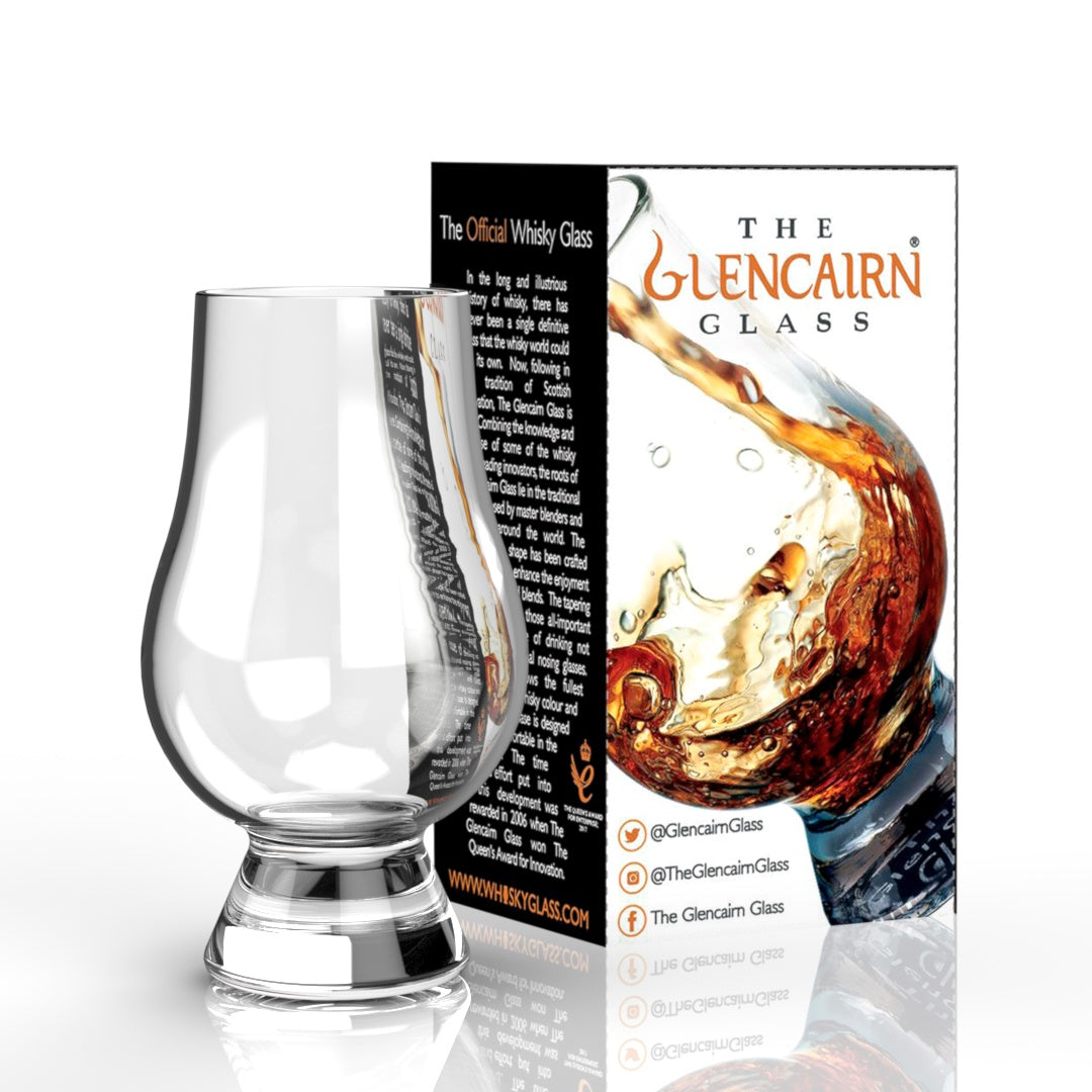 Glencairn glass in its retail carton, shown with whisky splashing