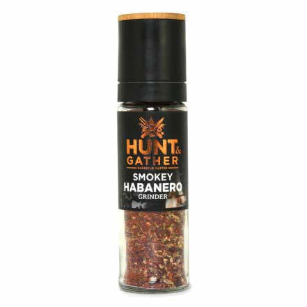 Hunt & Gather Smokey Habanero medium grinder, a glass jar of chilli flakes with a black grinder top