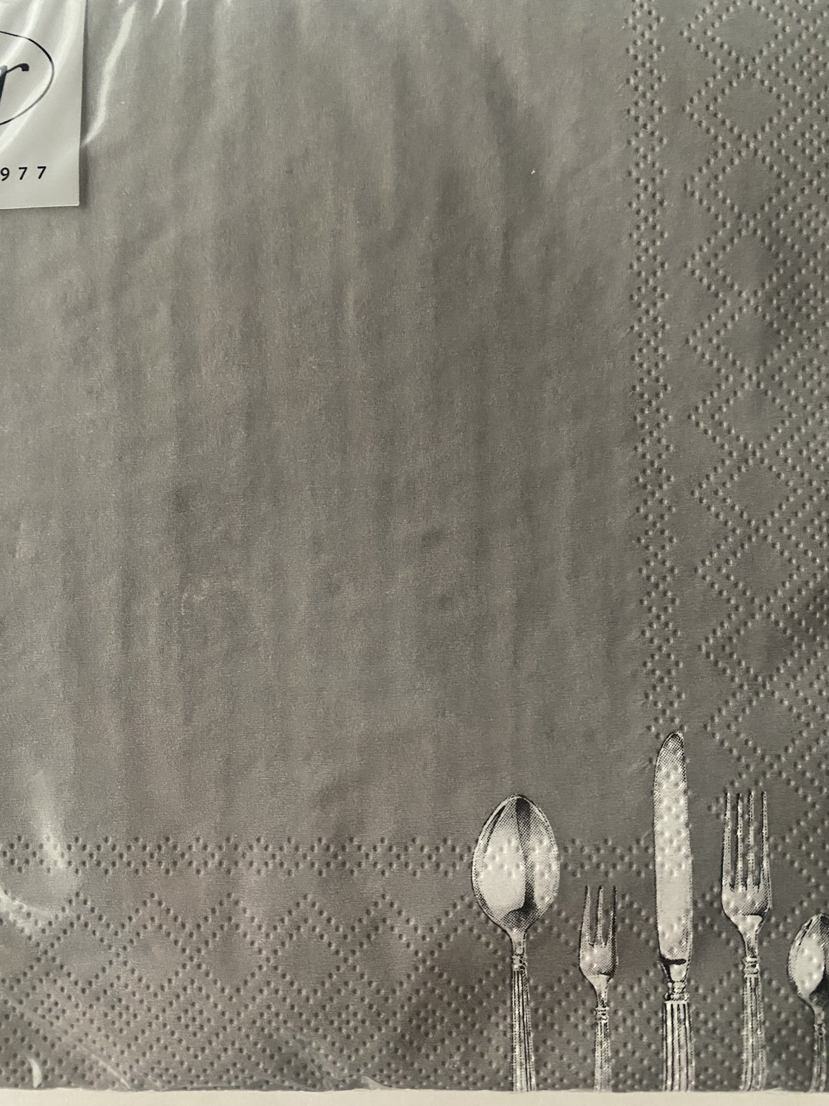IHR luncheon napkin in grey with a sketched cutlery pattern in the corner