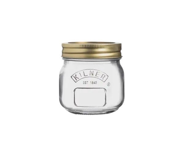 Kilner 250ml preserve jar in clear glass with a gold screw lid and a label panel