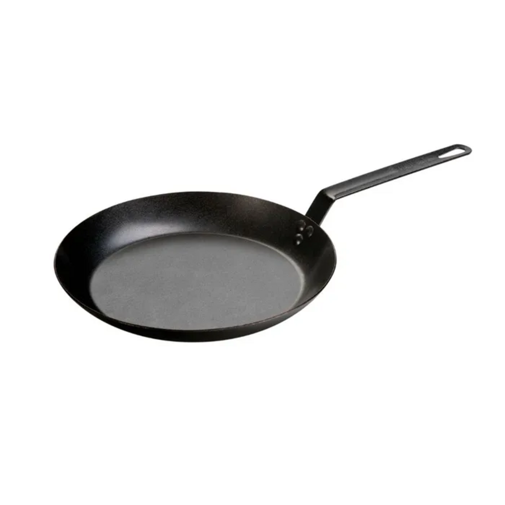 Lodge seasoned carbon steel pan in black with a long handle