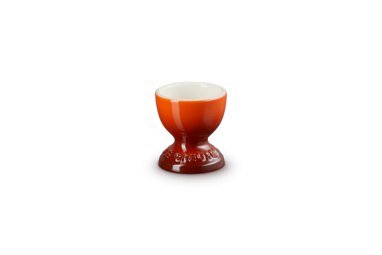 Le Creuset egg cup in flame orange with a footed base