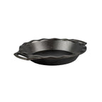 Lodge 23cm cast iron pie pan in black with a fluted edge and two small handles