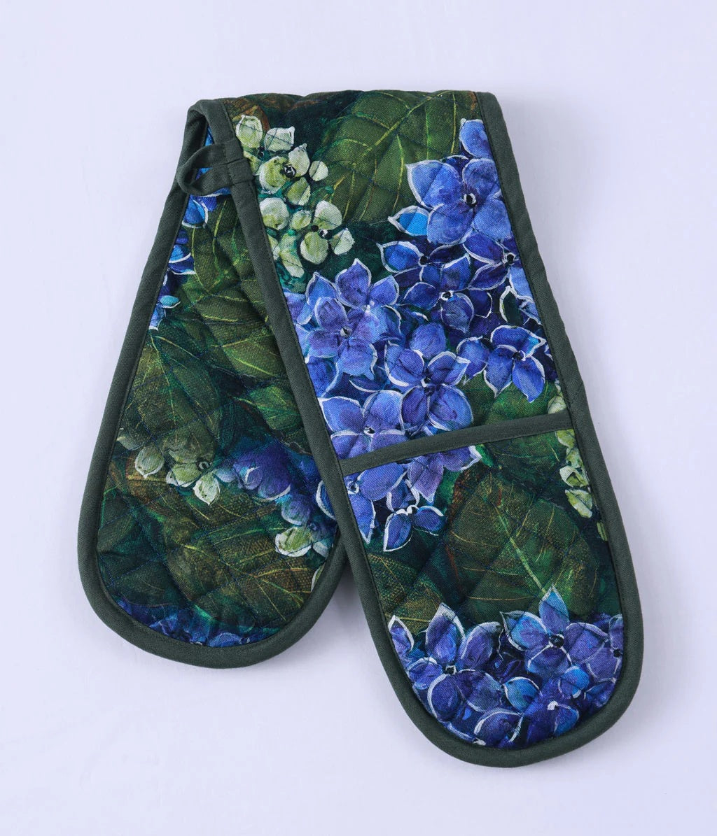 Matilda double oven glove in dark green with a blue hydrangea flower print