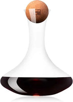 Vacu Vin wine decanter with a cork ball stopper, shown with red wine in the base