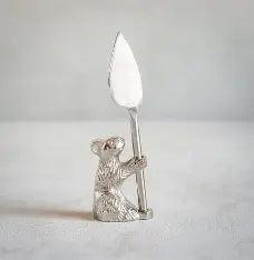 Old Mill Road Standing Guard mouse cheese knife, a silver mouse figure holding a leaf-shaped blade
