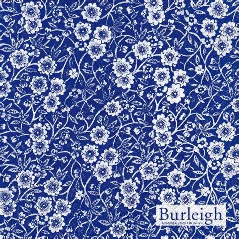 IHR cocktail napkin with a Burleigh Calico blue and white flower pattern