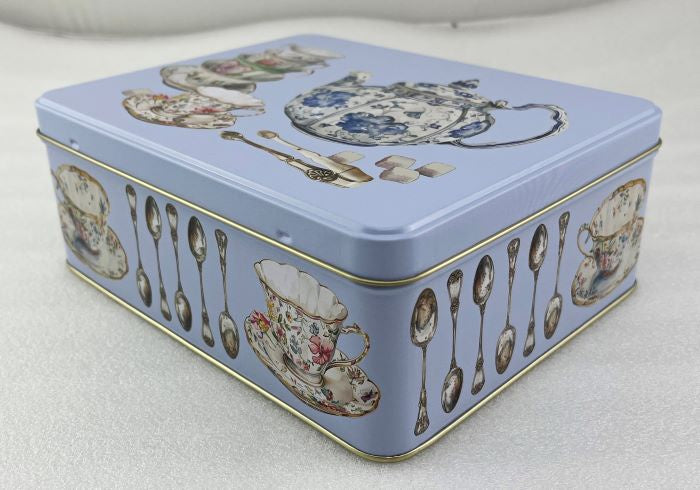 One Sugar Please deep rectangle tin in pale blue with a design of teapots, teacups and spoons