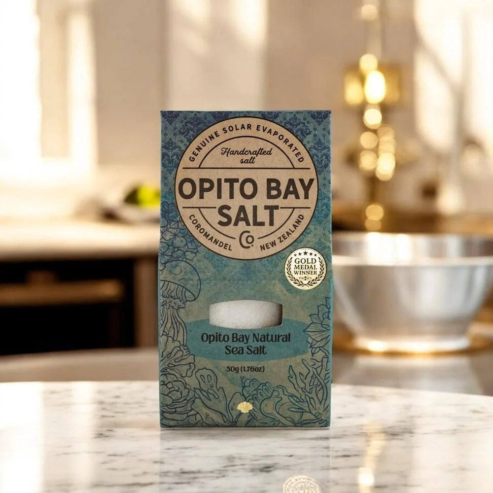 Opito Bay natural sea salt, 50g, shown in its packaging on a kitchen counter