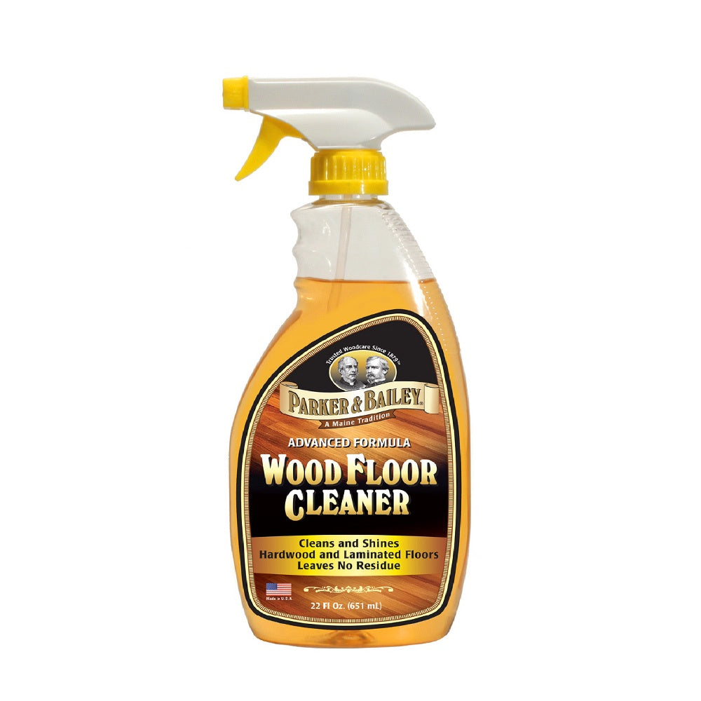 Parker & Bailey Wood Floor Cleaner, a spray bottle of amber liquid with a yellow trigger and black label