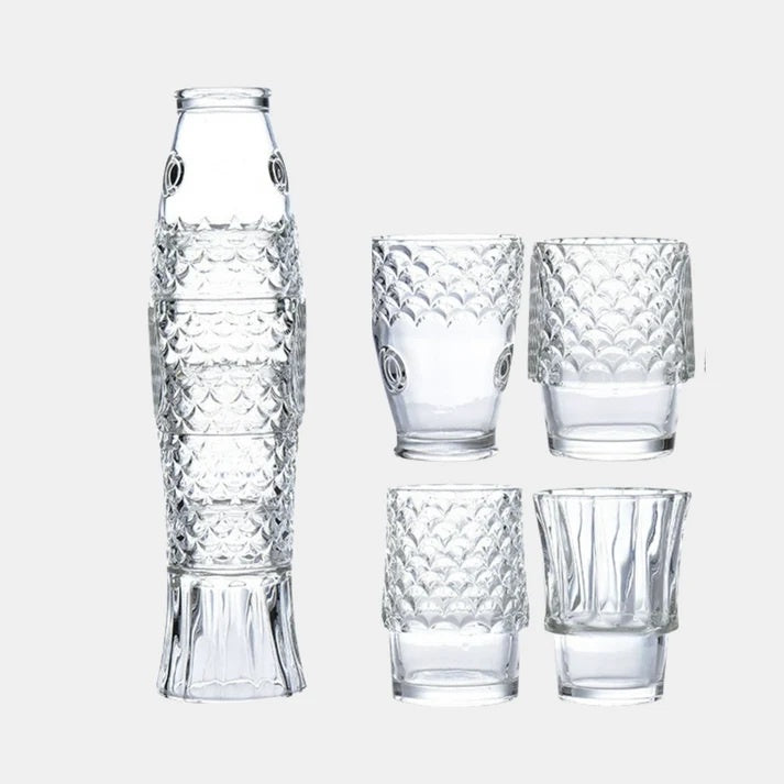 Fish stackable tumblers, a set of four in clear pressed glass shaped like a fish