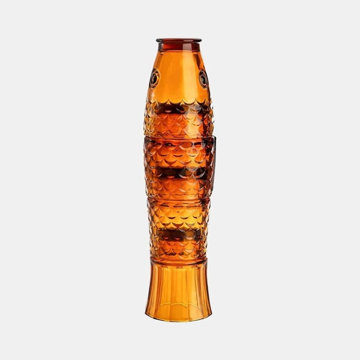 Fish stackable tumblers, a set of four in amber pressed glass shaped like a fish