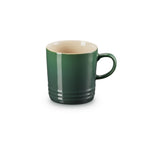 Le Creuset stoneware mug, 350ml, in dark green with a cream interior and ridged base