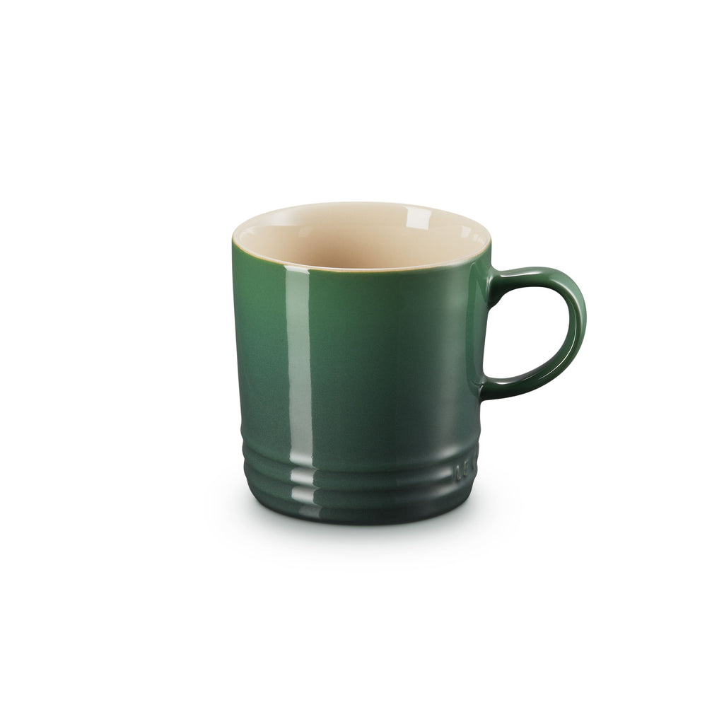 Le Creuset stoneware mug, 200ml, in dark green with a cream interior
