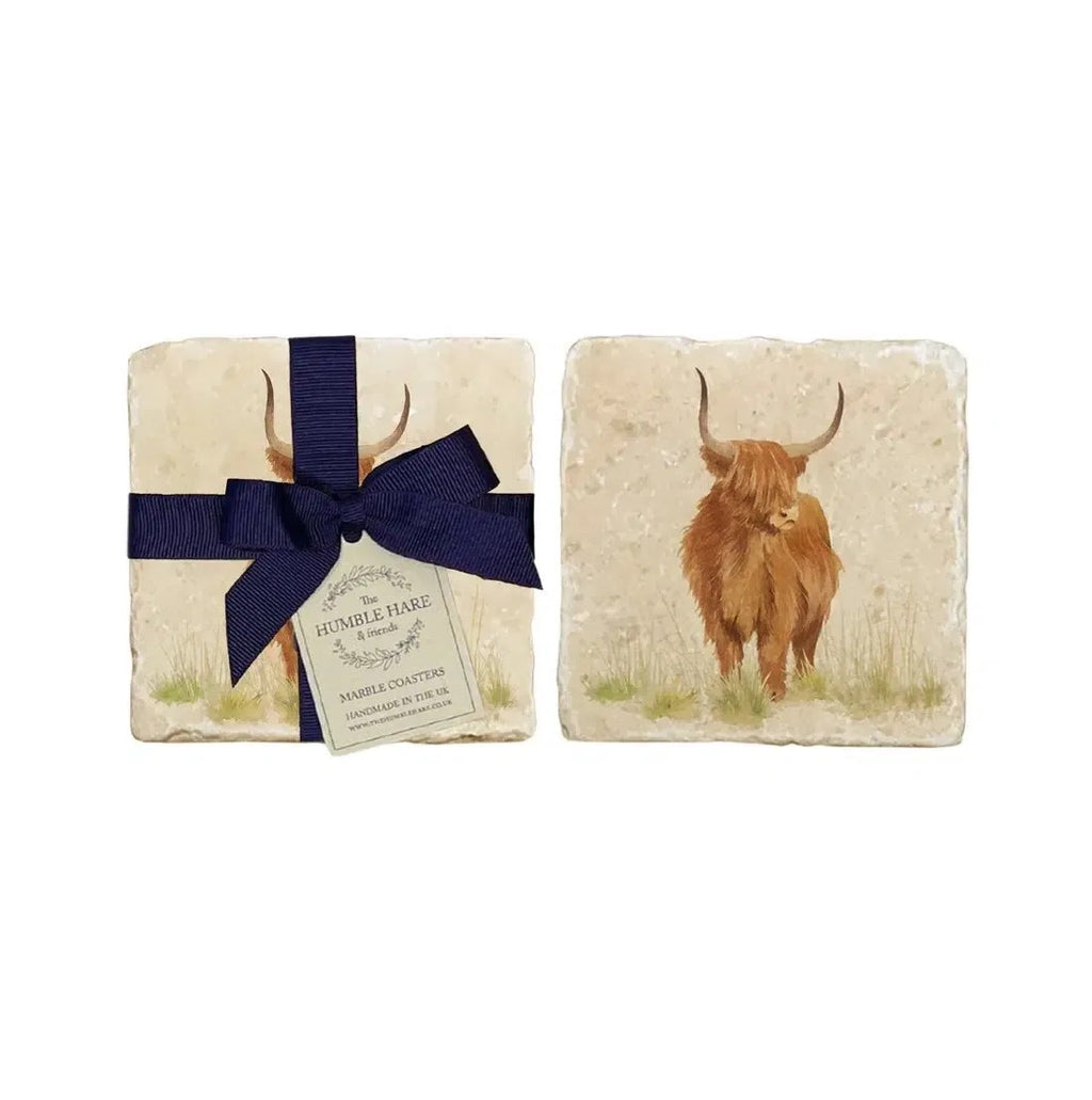 The Humble Hare Hairy Highlands coasters, two stone coasters with a Highland cow, one tied with a navy ribbon