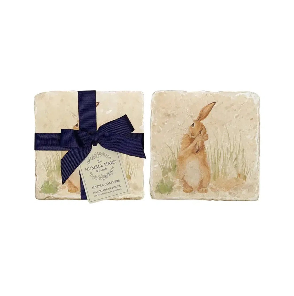 The Humble Hare stone coasters printed with a hare in grass, one tied with a navy ribbon
