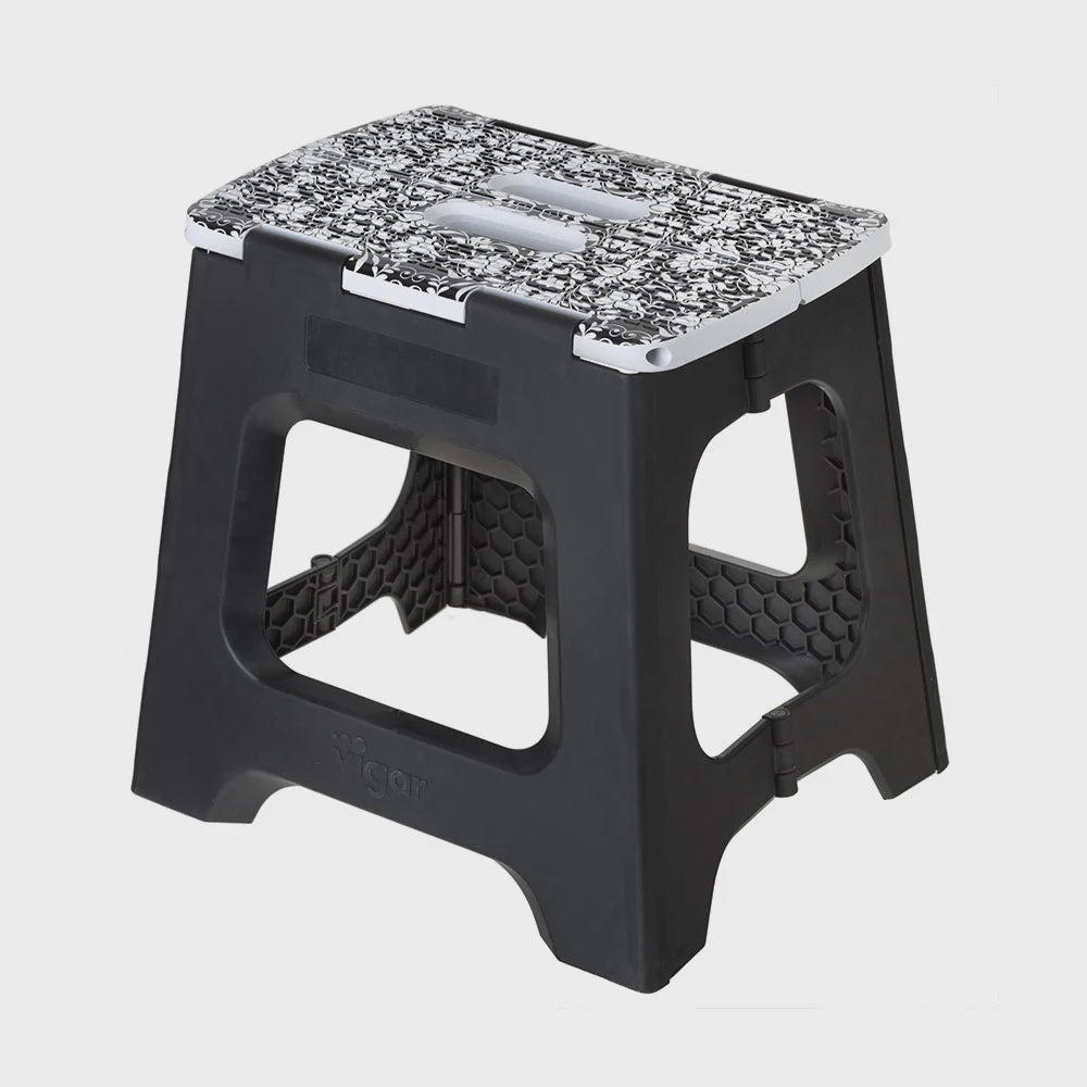 Vigar foldable stool in black with a floral patterned top