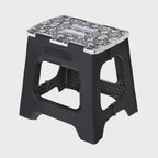 Vigar foldable stool in black with a floral patterned top