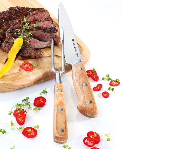 Zassenhaus carving set, a fork and knife with wooden handles, styled with steak and chilli