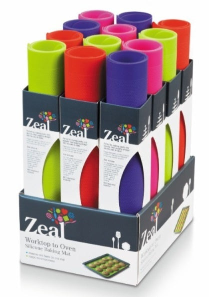 Zeal silicone baking mats in bright colours, shown rolled in a retail display of boxes