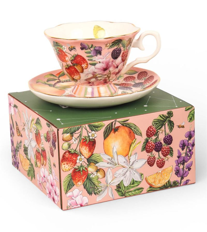 La La Land Bountiful Harvest tea cup and saucer with a berry and floral pattern, shown on its box