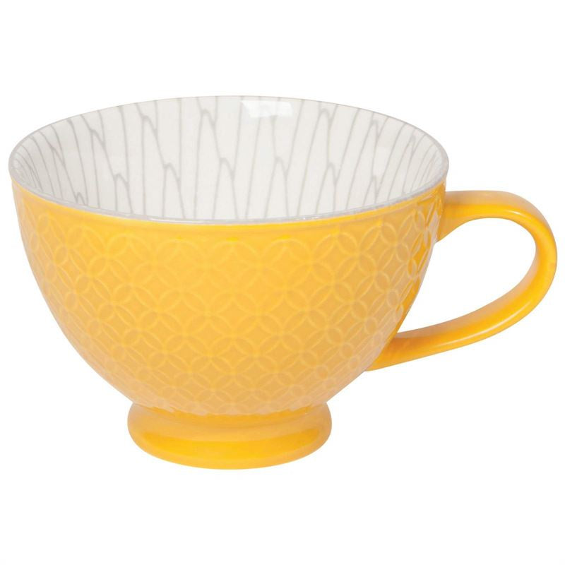 Now Designs yellow stamped latte stoneware mug with a geometric pattern and a grey patterned interior