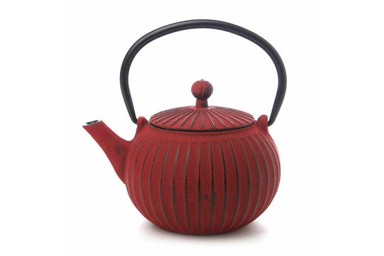 Teaology cast iron teapot in red and black with a ribbed pattern and an arched handle