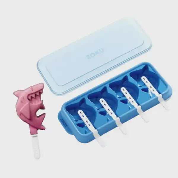 Zoku Shark Pops blue silicone tray with a lid, white sticks and a pink shark-shaped ice pop