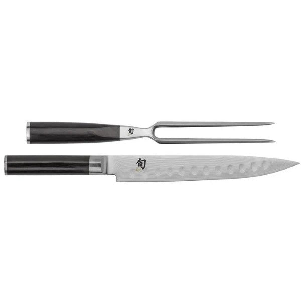 Kai Shun Classic carving set, a fork and knife with dark wood handles, shown in a gift box
