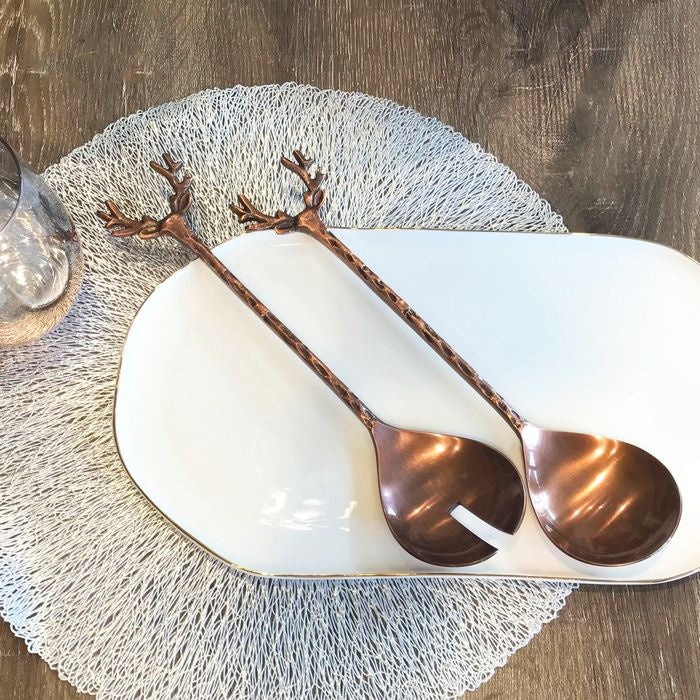 Old Mill Road Oh Deer bronze salad servers with deer antler handles, on a white platter with a place mat