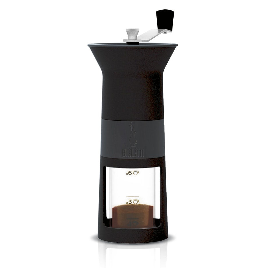 Bialetti hand coffee grinder in black with a crank handle and a glass hopper