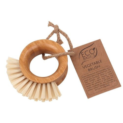 White Magic Eco Basics vegetable brush with a bamboo ring handle and natural bristles, with a hang tag
