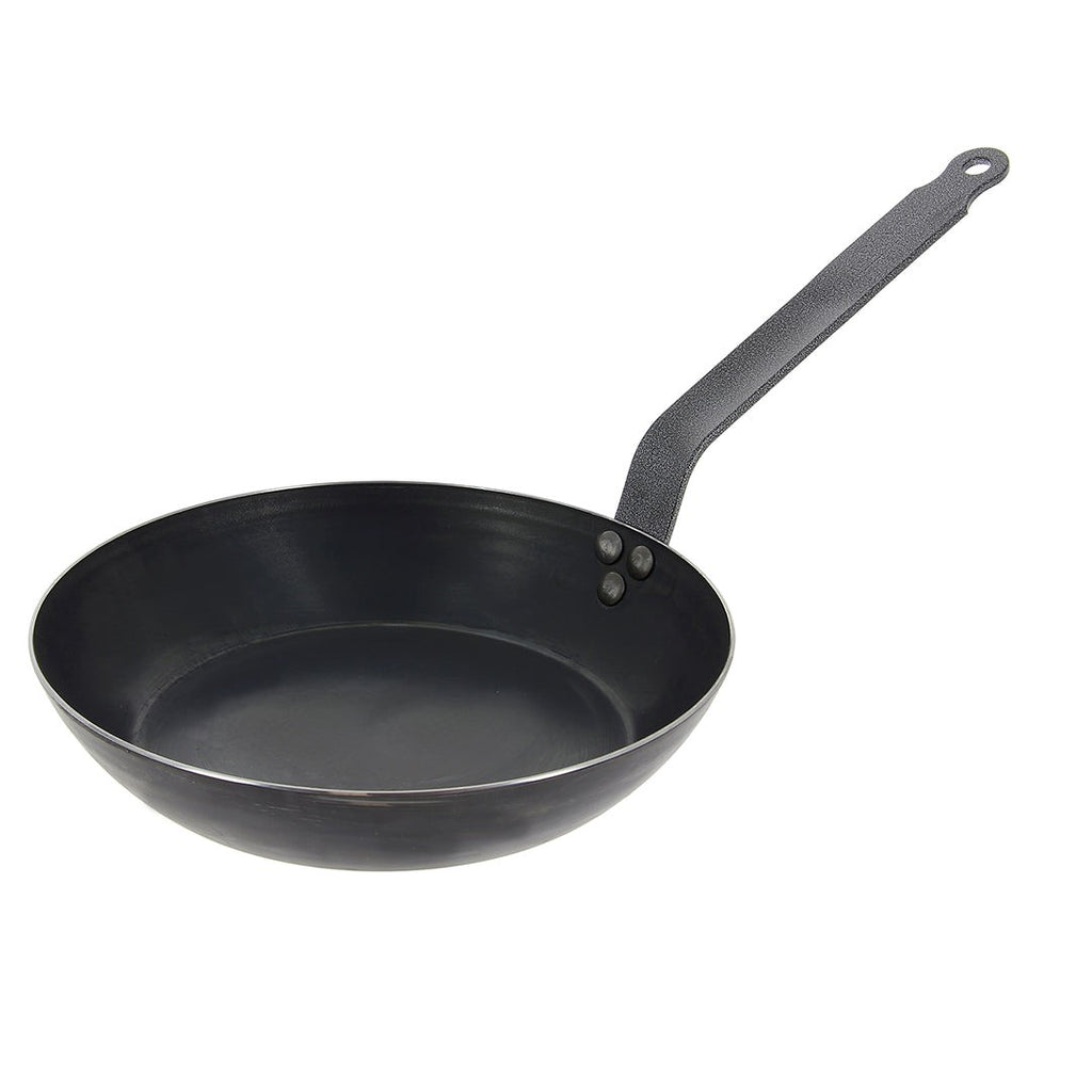 De Buyer Blue Steel fry pan with a dark carbon steel surface and a riveted handle