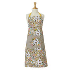 Ulster Weavers cotton apron with a Beekeeper print of flowers and bees and a beehive pocket, shown on a dress form