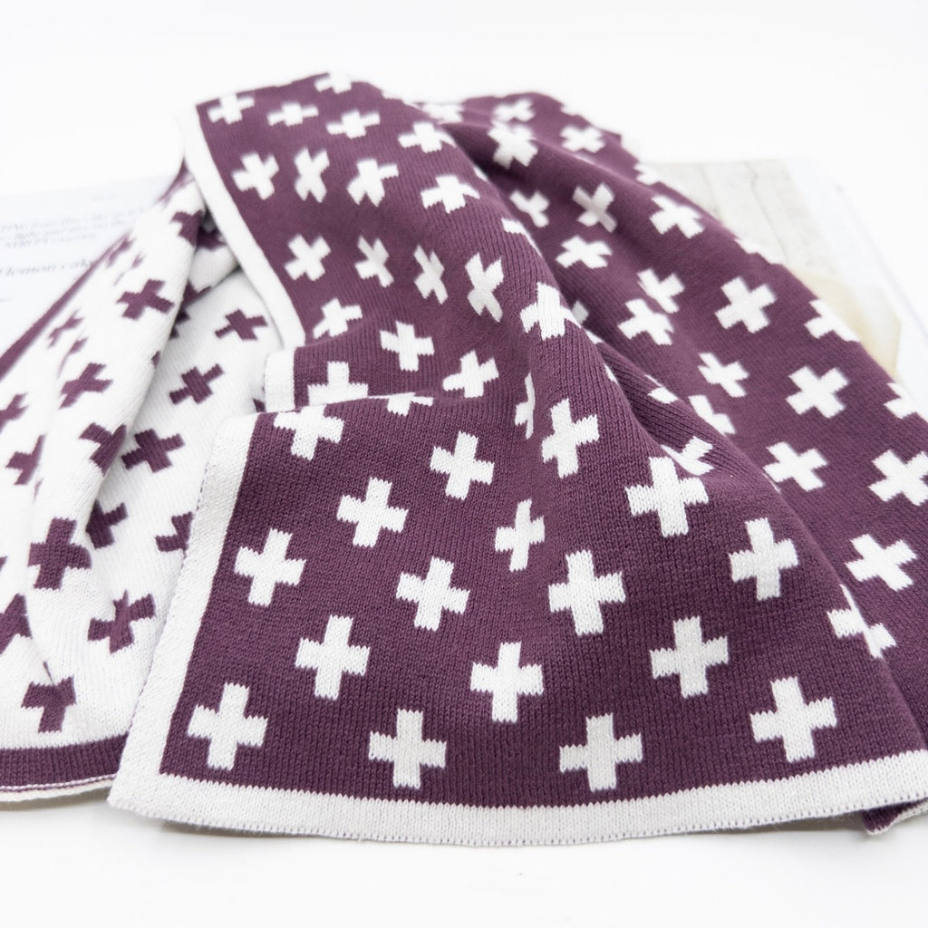 Ecovask kitchen towel in a plum and white cross pattern, folded