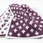 Ecovask kitchen towel in a plum and white cross pattern, folded