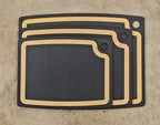 Epicurean Gourmet cutting boards with a juice groove, a nested set of three in slate black with tan edges