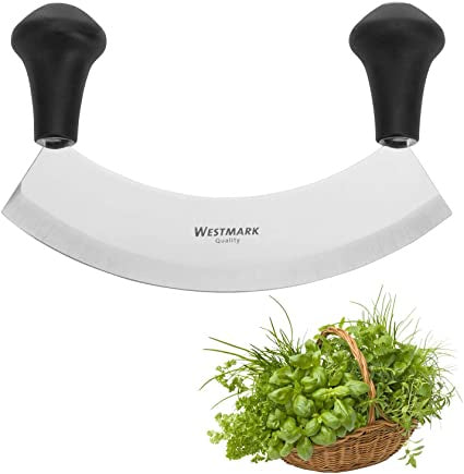 Westmark mincing herb knife, a curved double-handled blade shown with fresh herbs