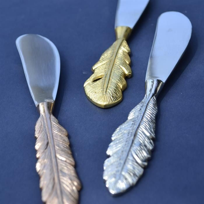 Old Mill Road feather spreaders, three butter spreaders with feather-shaped handles in gold and silver