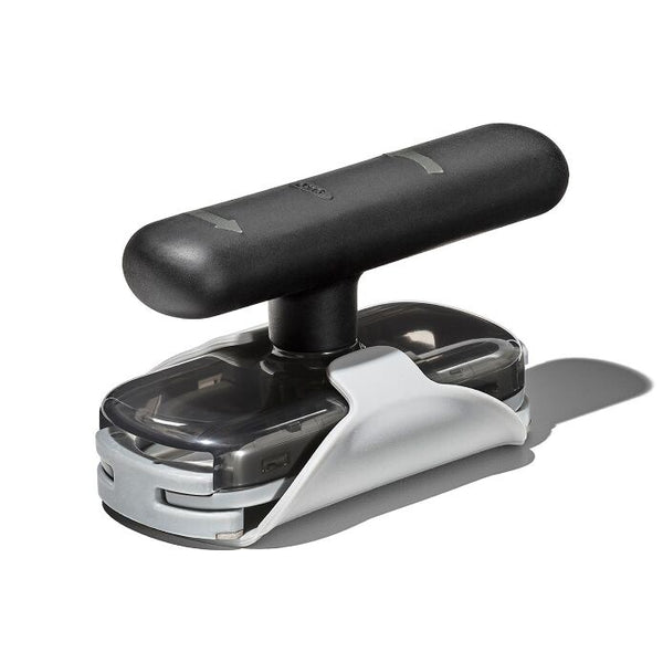 OXO Good Grips twisting jar opener with a black handle, a grey base pad and a clear grip