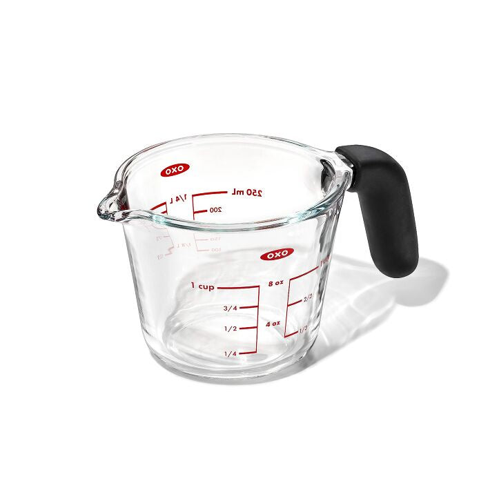 OXO Good Grips glass measuring cup with a black handle and red markings