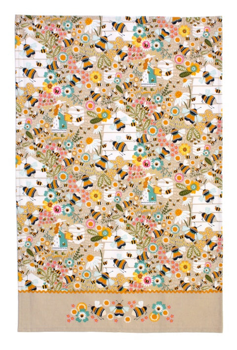 Ulster Weavers Bee Keeper cotton tea towel with bees, flowers and beehives on cream with a tan border
