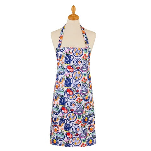 Ulster Weavers Mediterranean Plates cotton apron with a print of colourful plates and dishes, shown on a mannequin