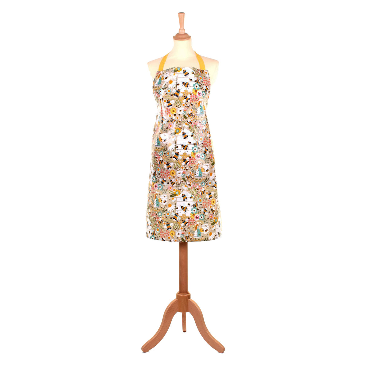 Ulster Weavers Bee Keeper biodegradable PVC apron with a bee and hive print, shown on a mannequin