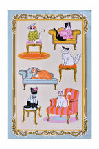 Ulster Weavers Cool Cats cotton tea towel with cats on armchairs and sofas in a gold border